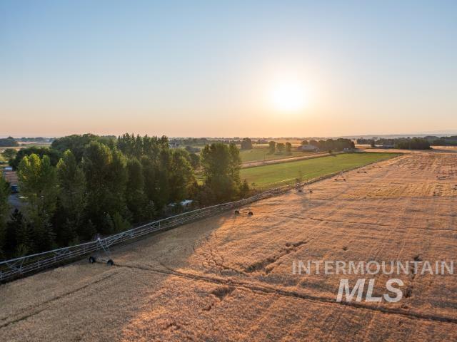 Yard at dusk featuring a view of countryside