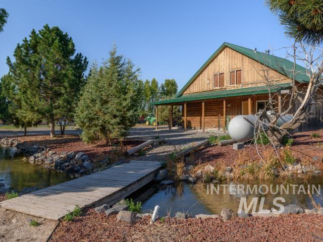 Dock area with a porch and a water view