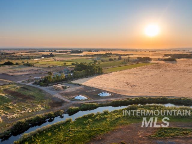 Aerial overview of property's location featuring a nearby body of water and rural landscape