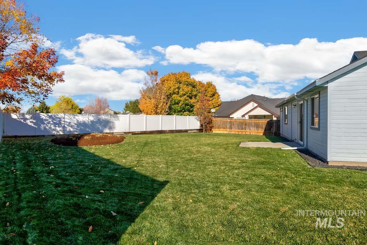 View of fenced backyard