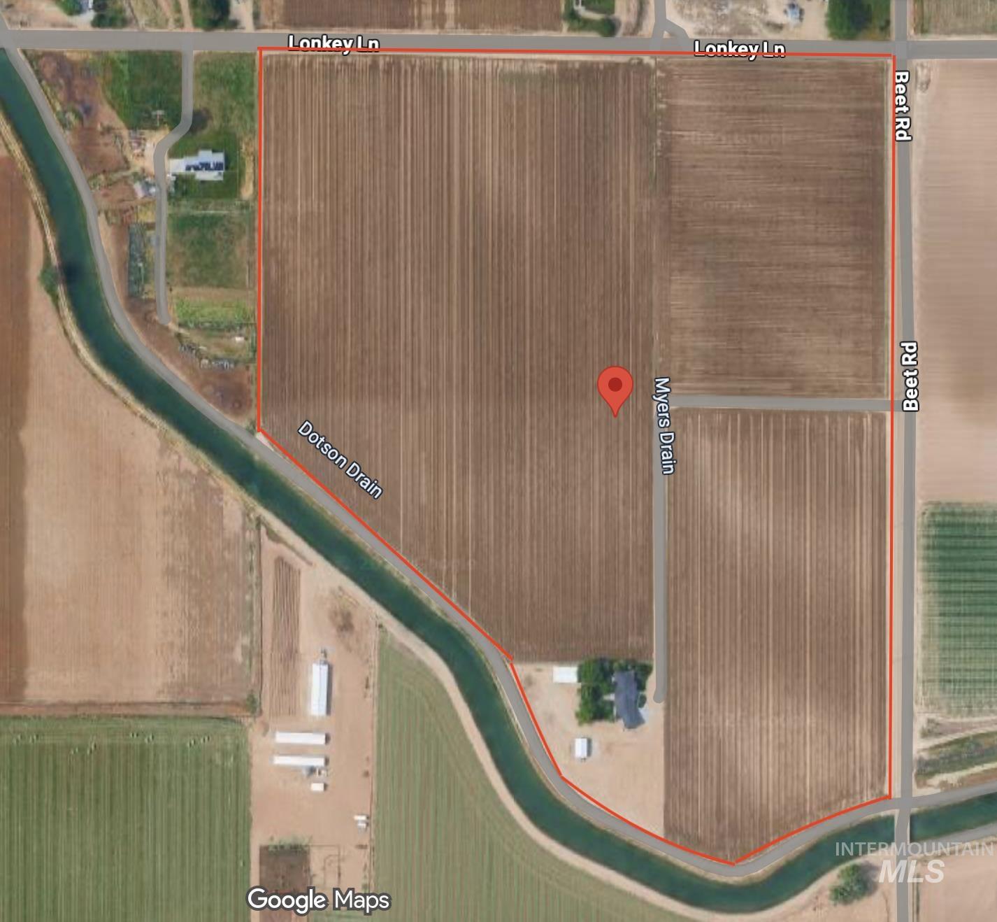 Aerial map of property and surrounding area with property parcel outlined