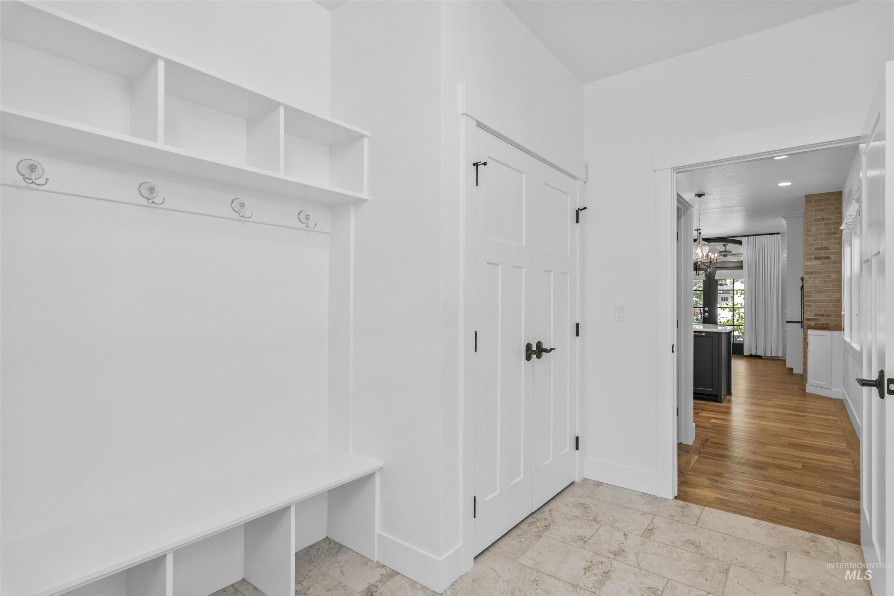 Mudroom with a chandelier