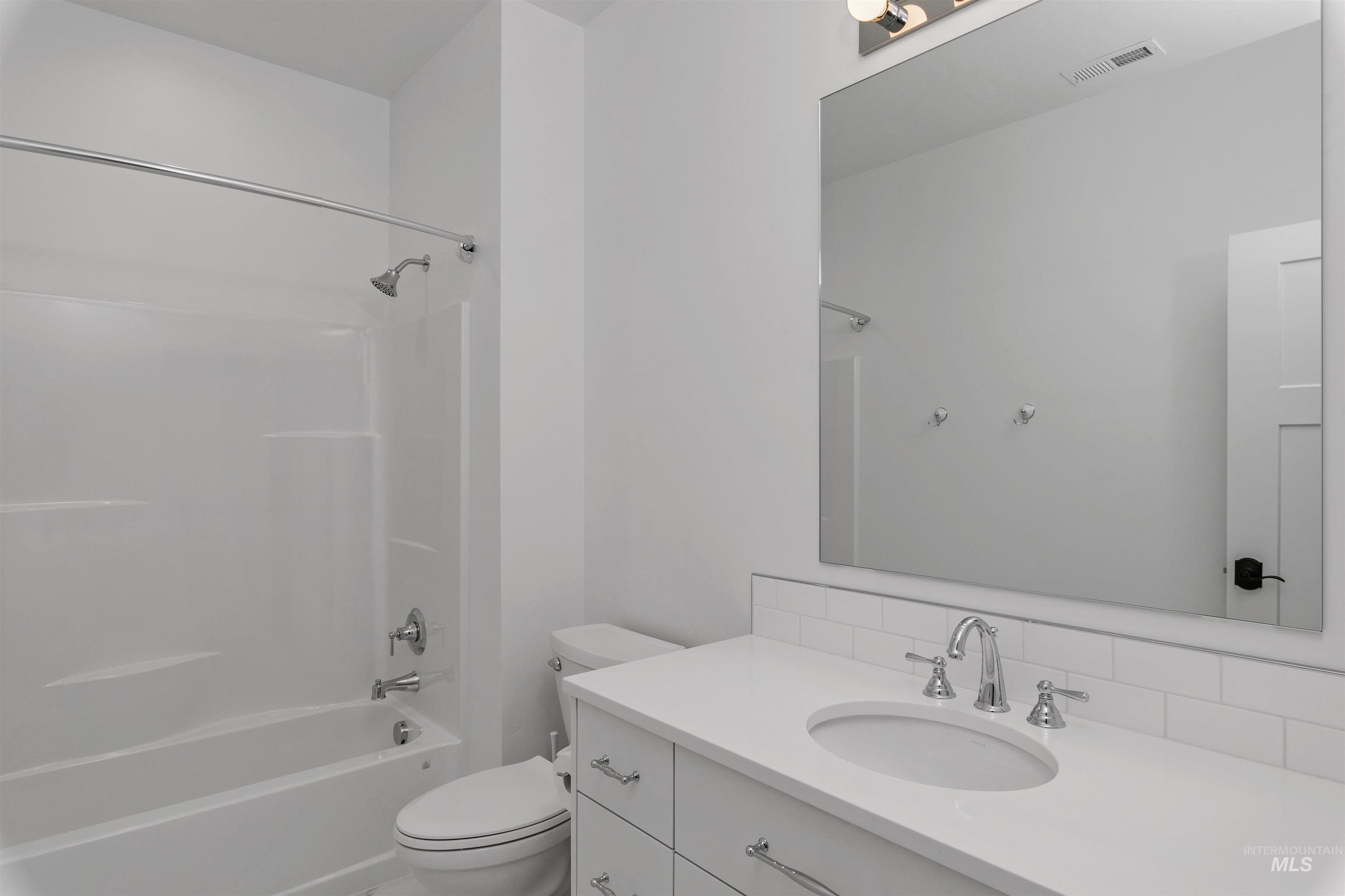 Bathroom with bathtub / shower combination and vanity