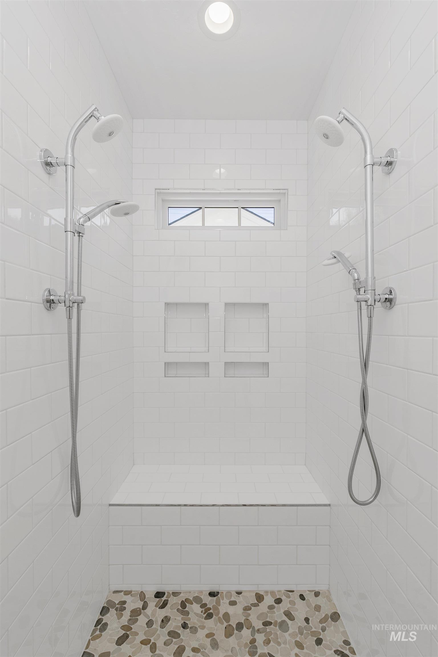Full bath featuring a shower stall