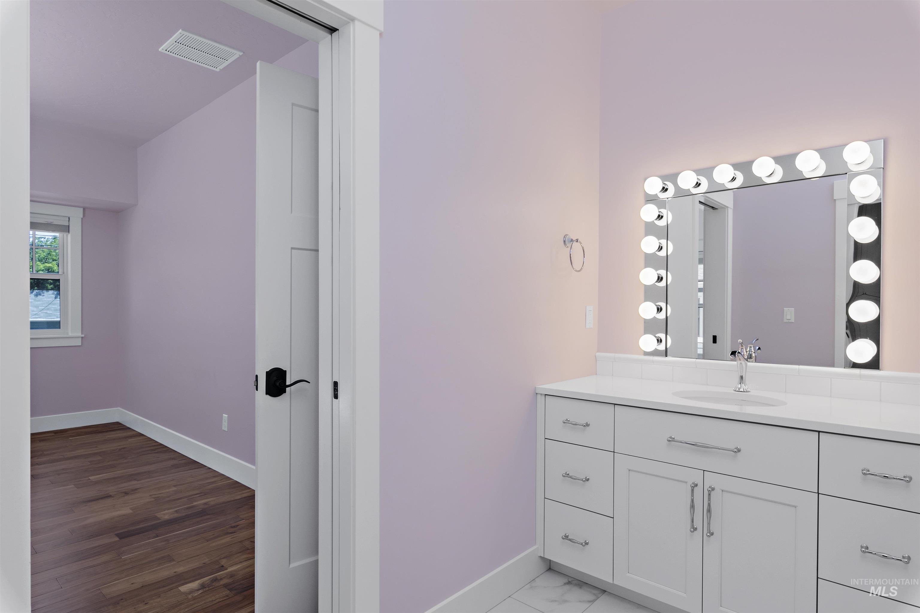 Bathroom with baseboards and vanity