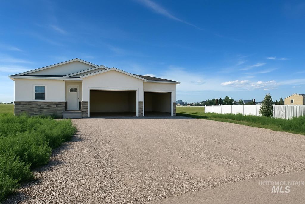 Photo of 102 N Stocktrail Dr, Rigby, ID 83442 (MLS # 98969766)