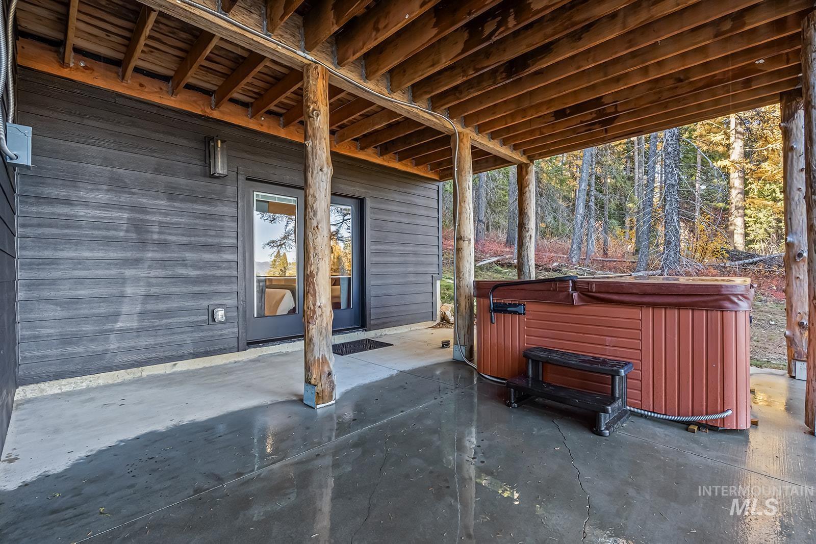 View of patio / terrace featuring a hot tub