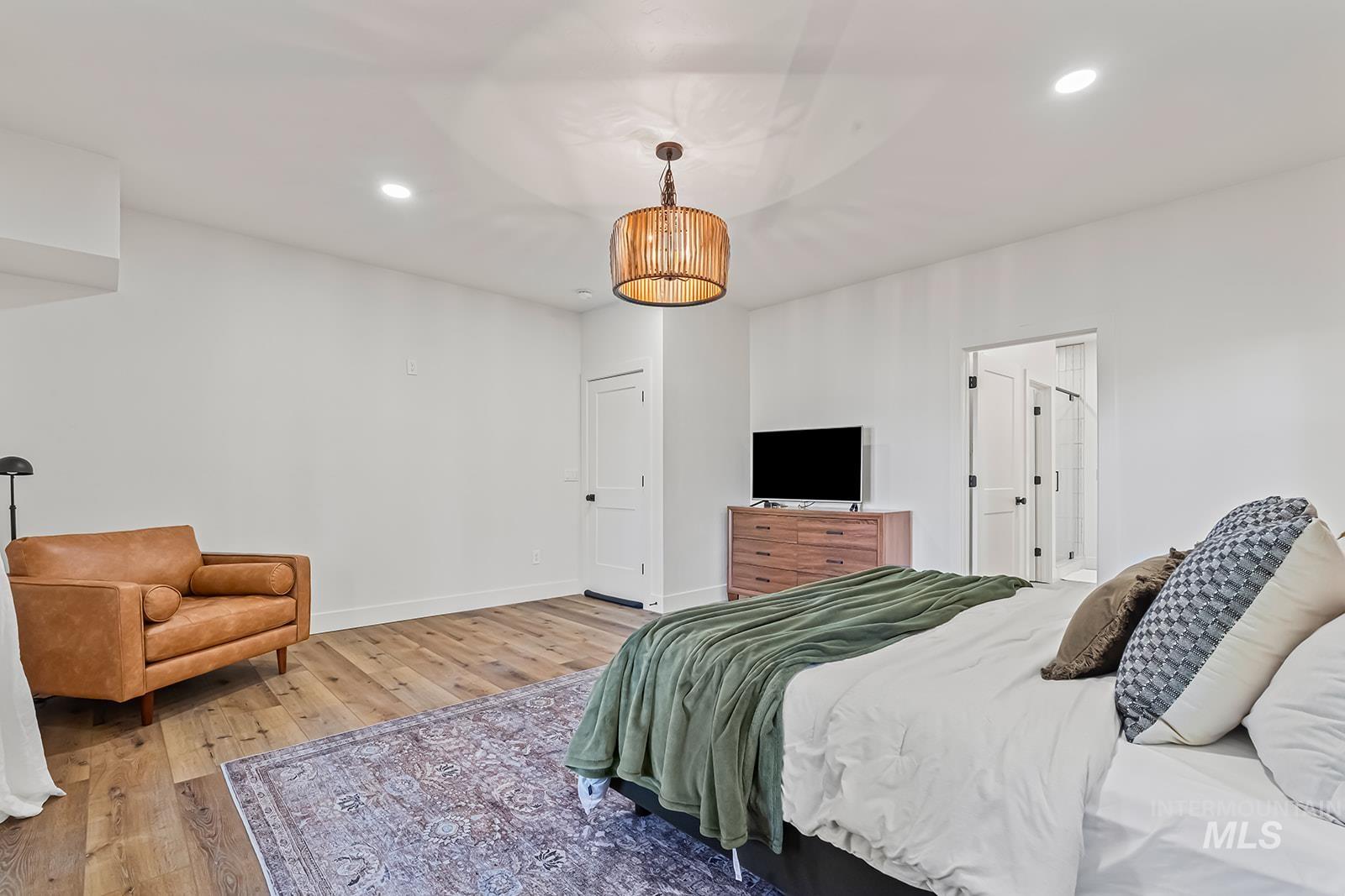 Bedroom featuring light wood finished floors and recessed lighting