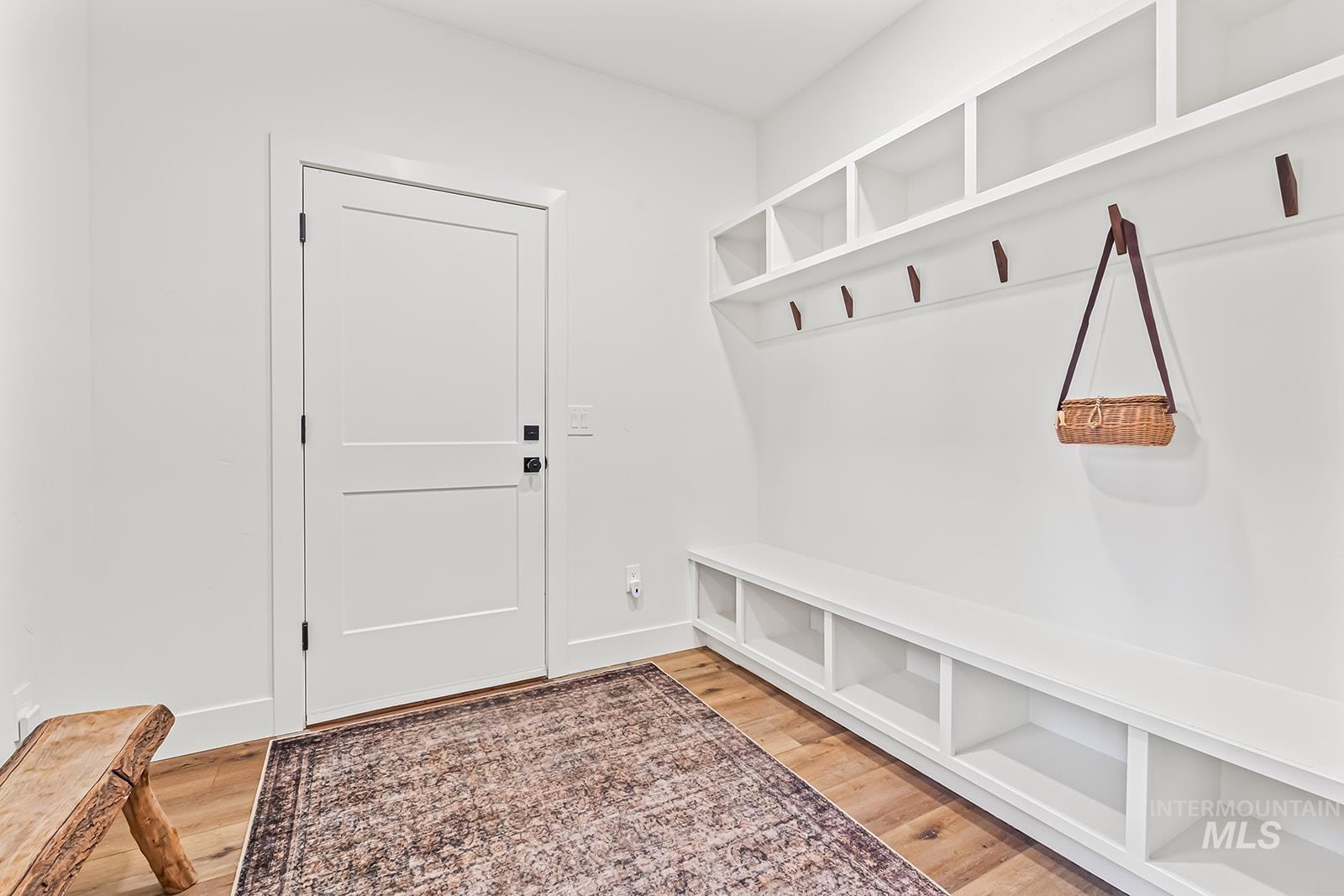 Mudroom with light wood finished floors