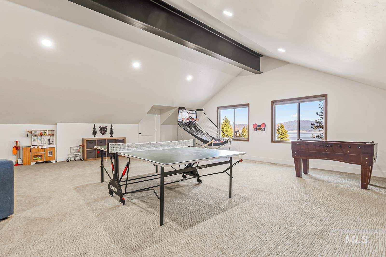 Recreation room with light carpet, beam ceiling, and recessed lighting
