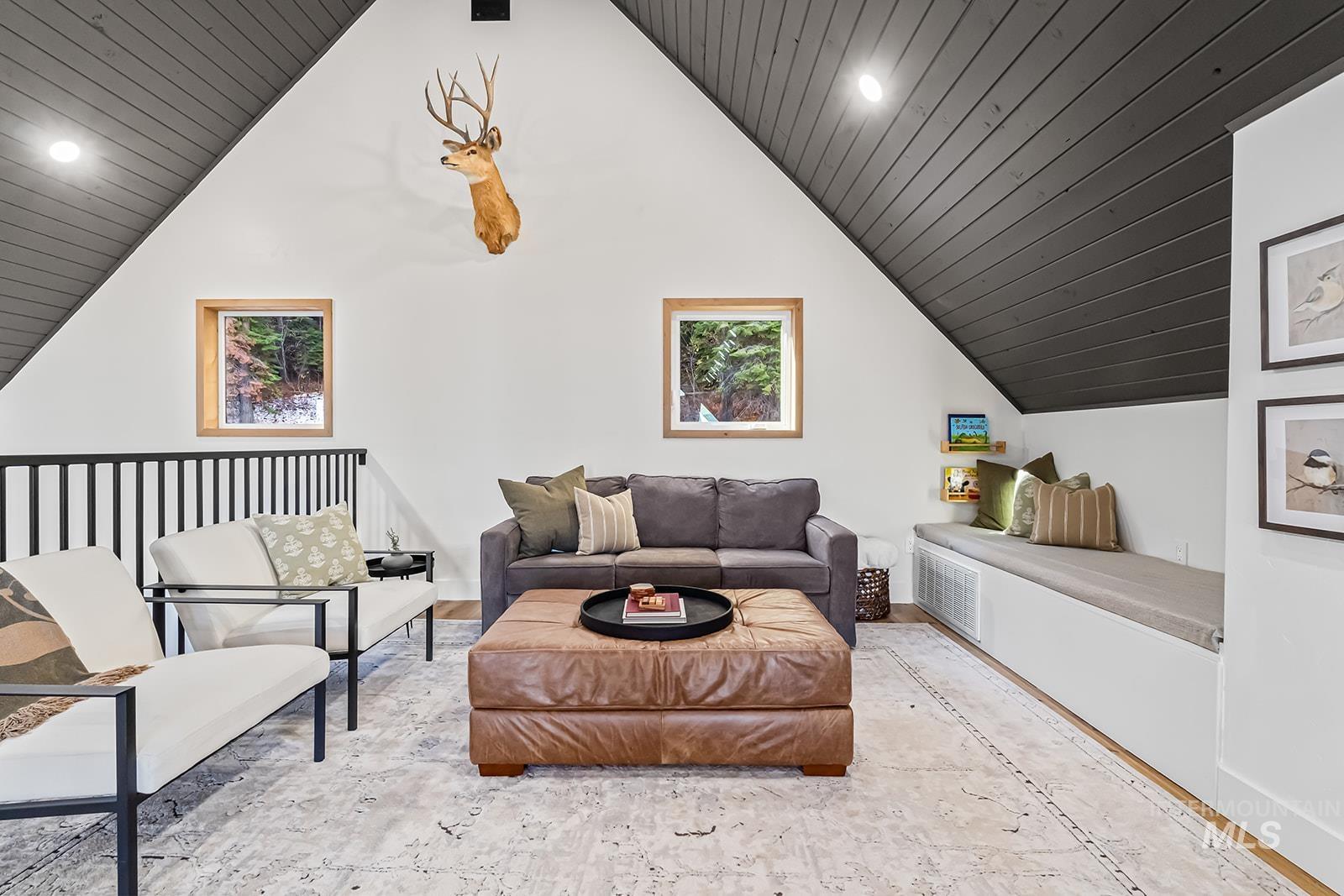 Sitting room with recessed lighting and wooden ceiling