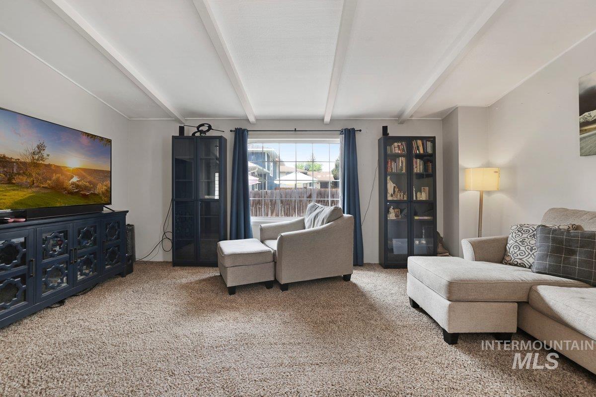 Living room featuring carpet flooring