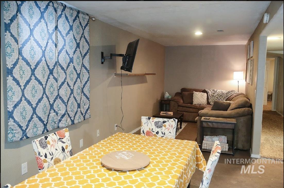 Dining room with concrete flooring