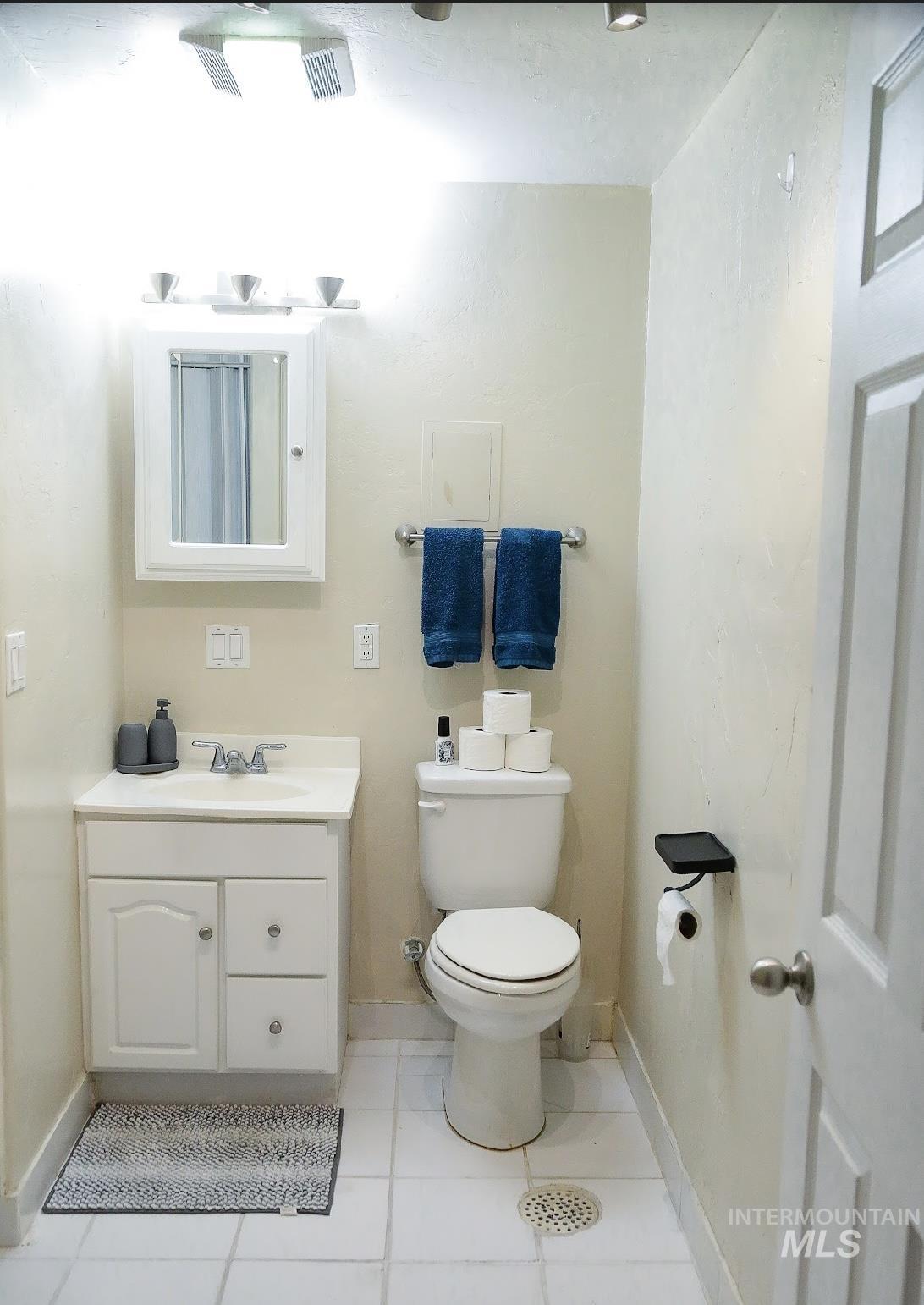 Bathroom featuring vanity and tile patterned floors