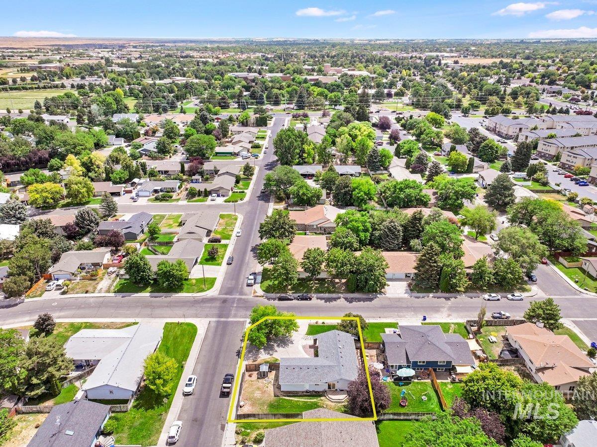 Aerial perspective of suburban area with property parcel outlined