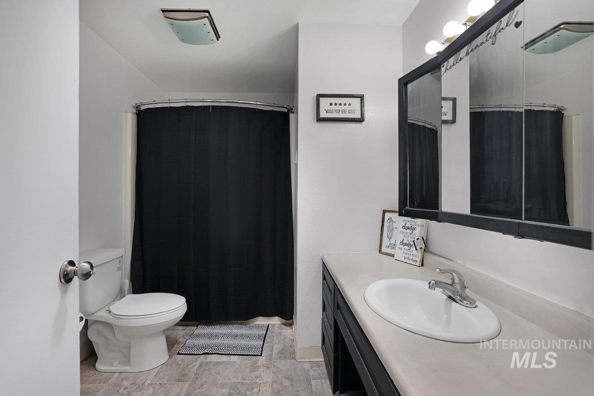 Bathroom with vanity and a shower with curtain