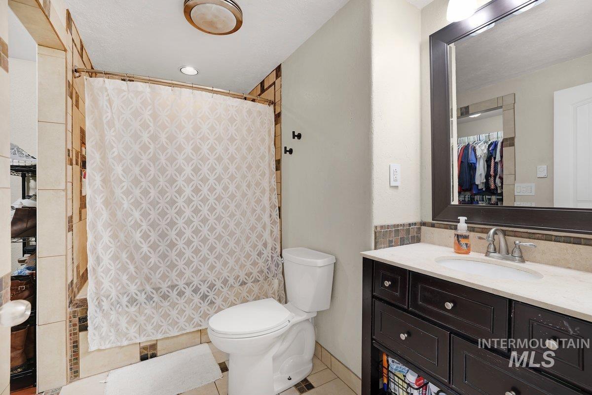 Full bathroom featuring vanity and tile patterned floors