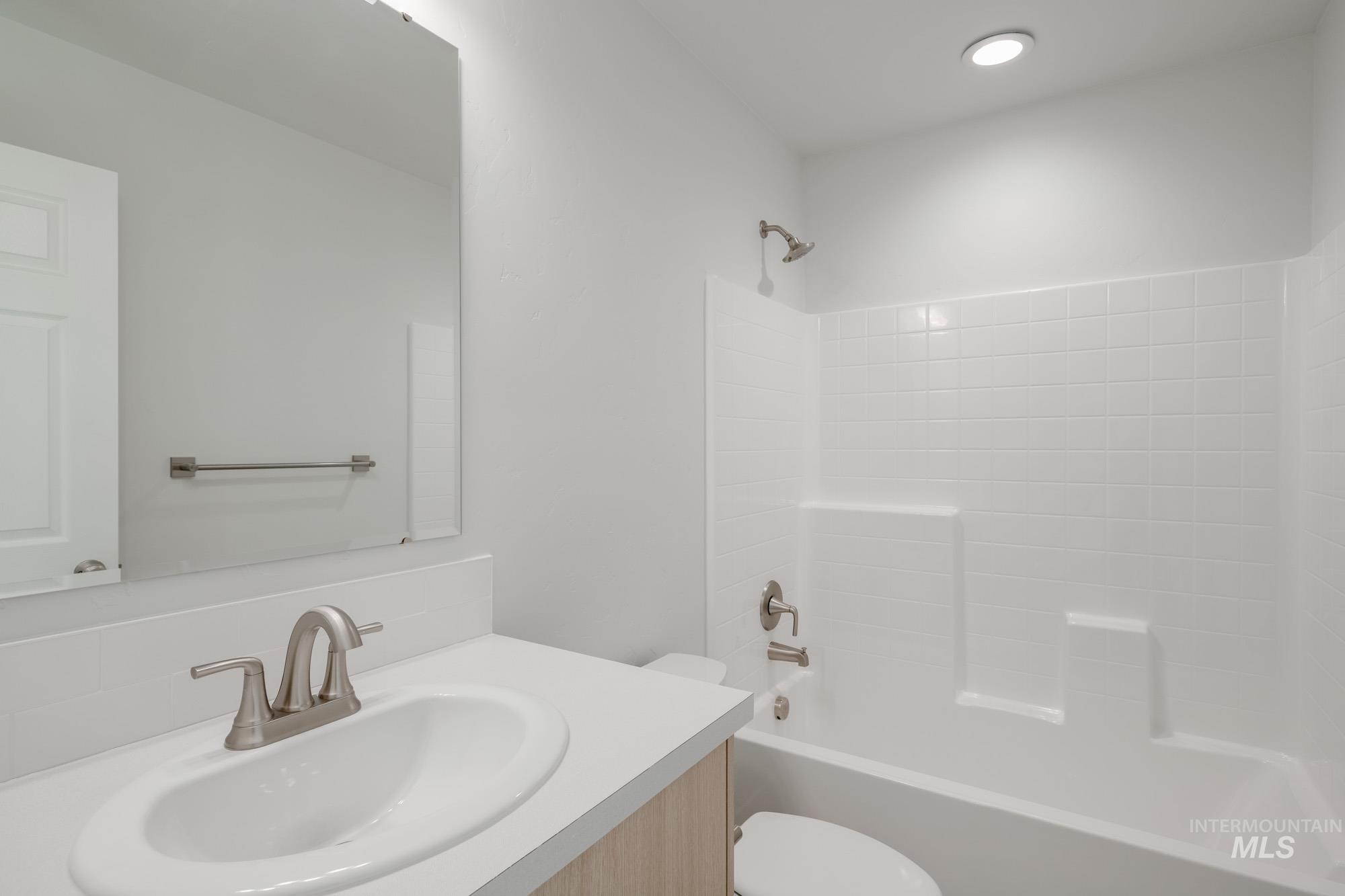 Full bathroom featuring vanity and bathtub / shower combination