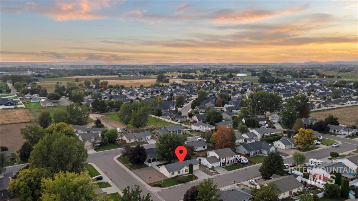 Aerial view of property's location featuring nearby suburban area