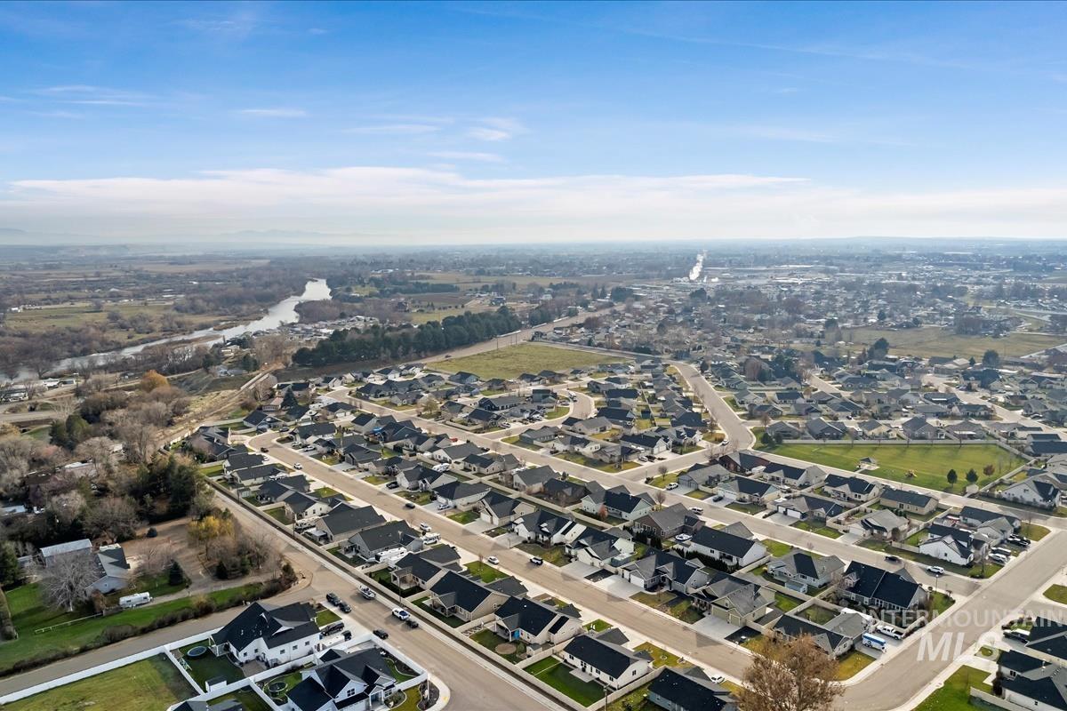 Aerial overview of property's location featuring nearby suburban area