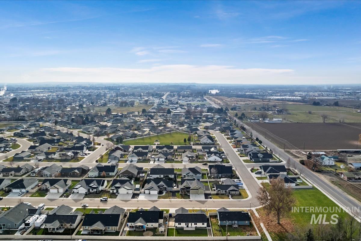 Aerial overview of property's location featuring nearby suburban area