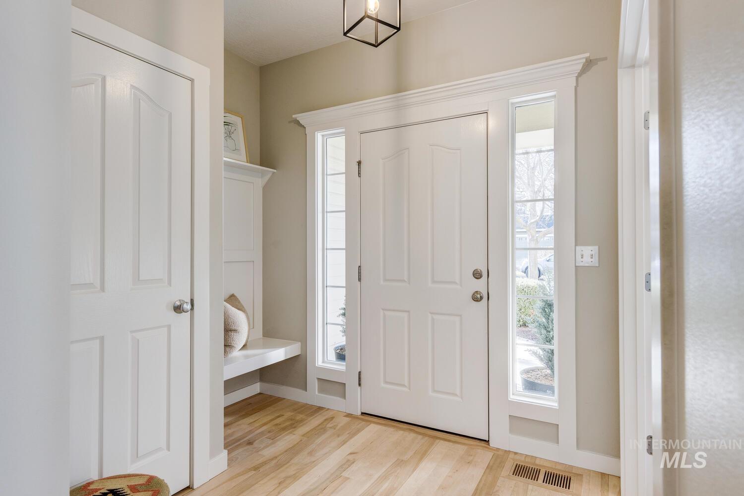 Entryway with light wood-type flooring