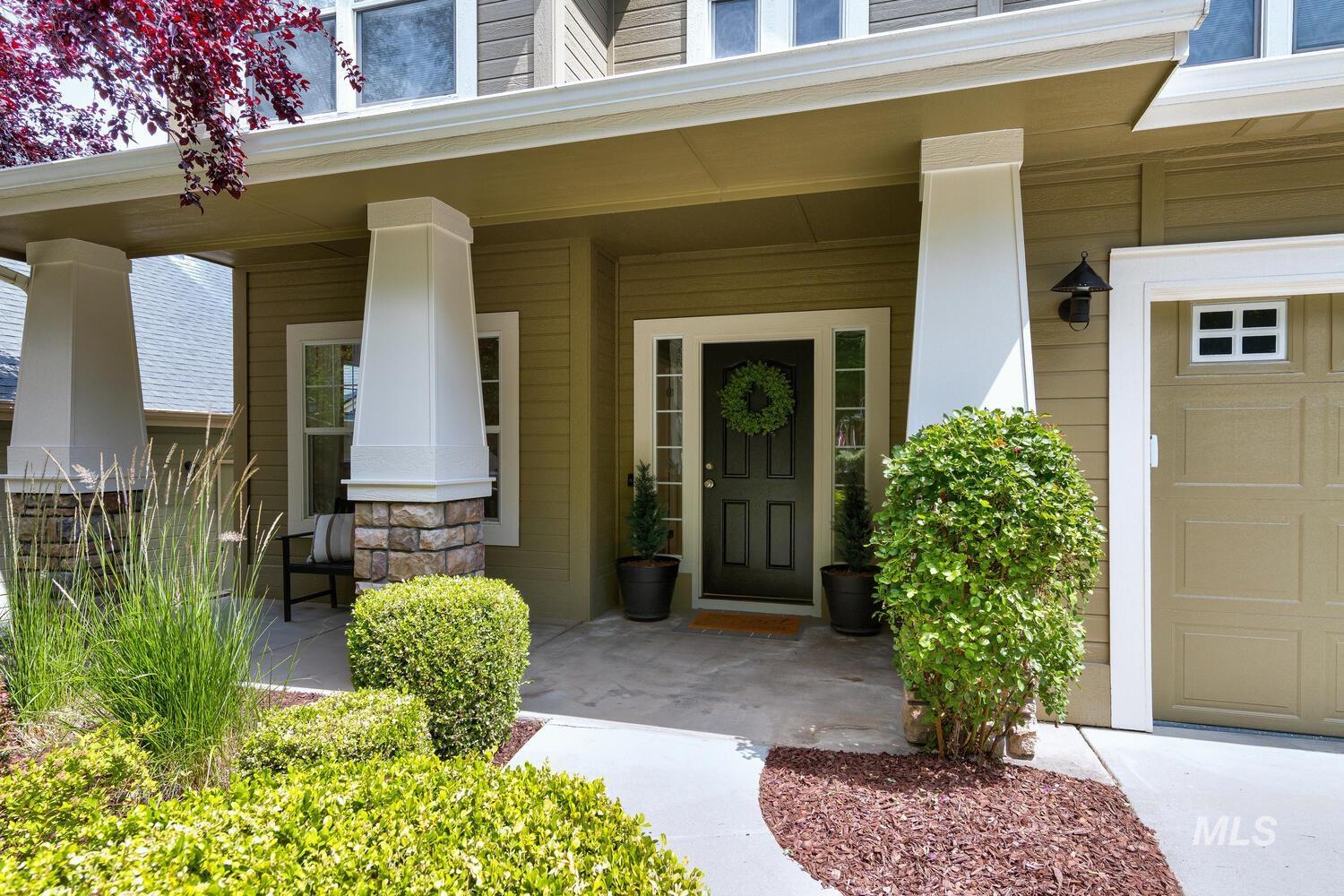 Entrance to property featuring a porch