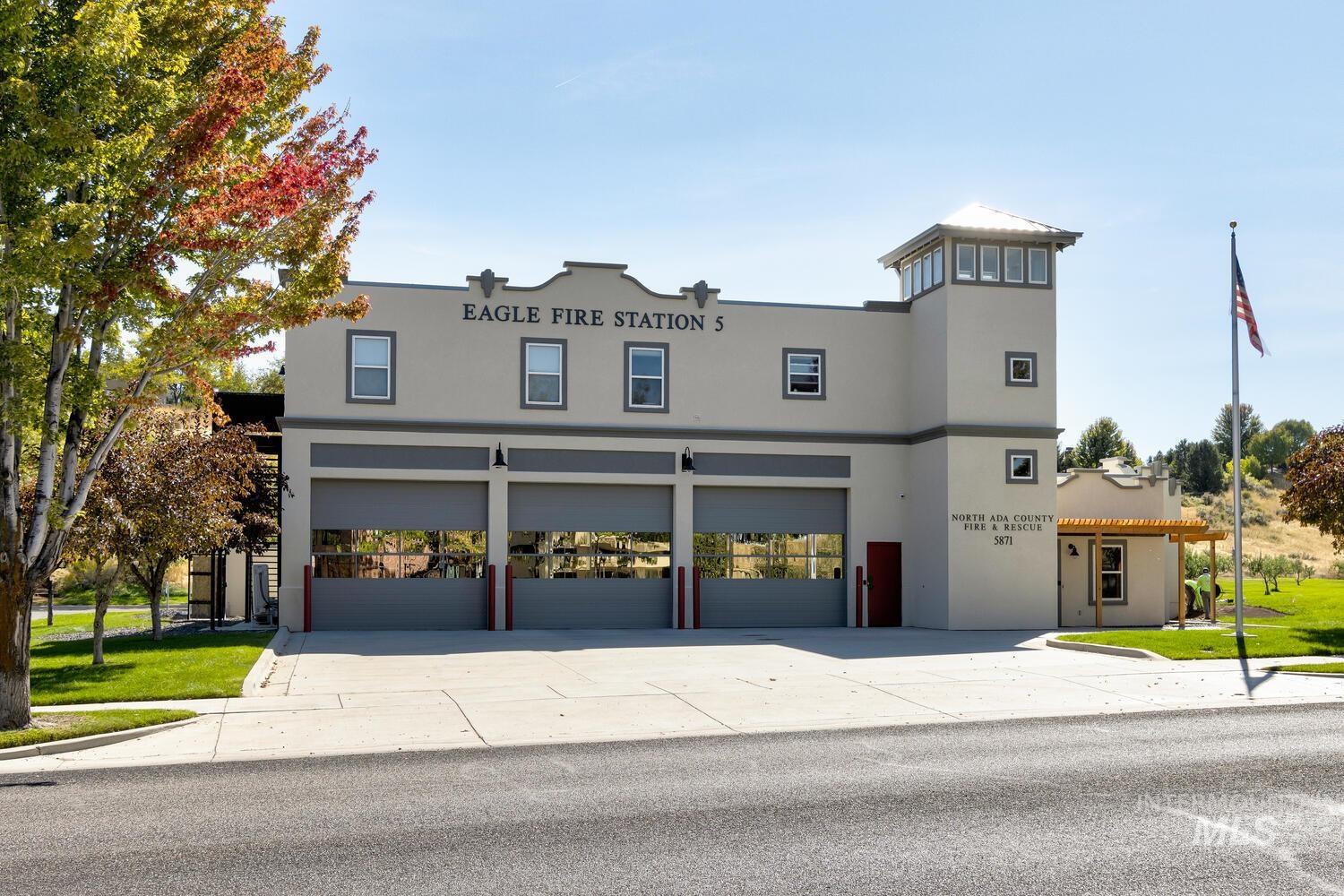 View of front of home featuring stucco siding, concrete driveway, and a garage
