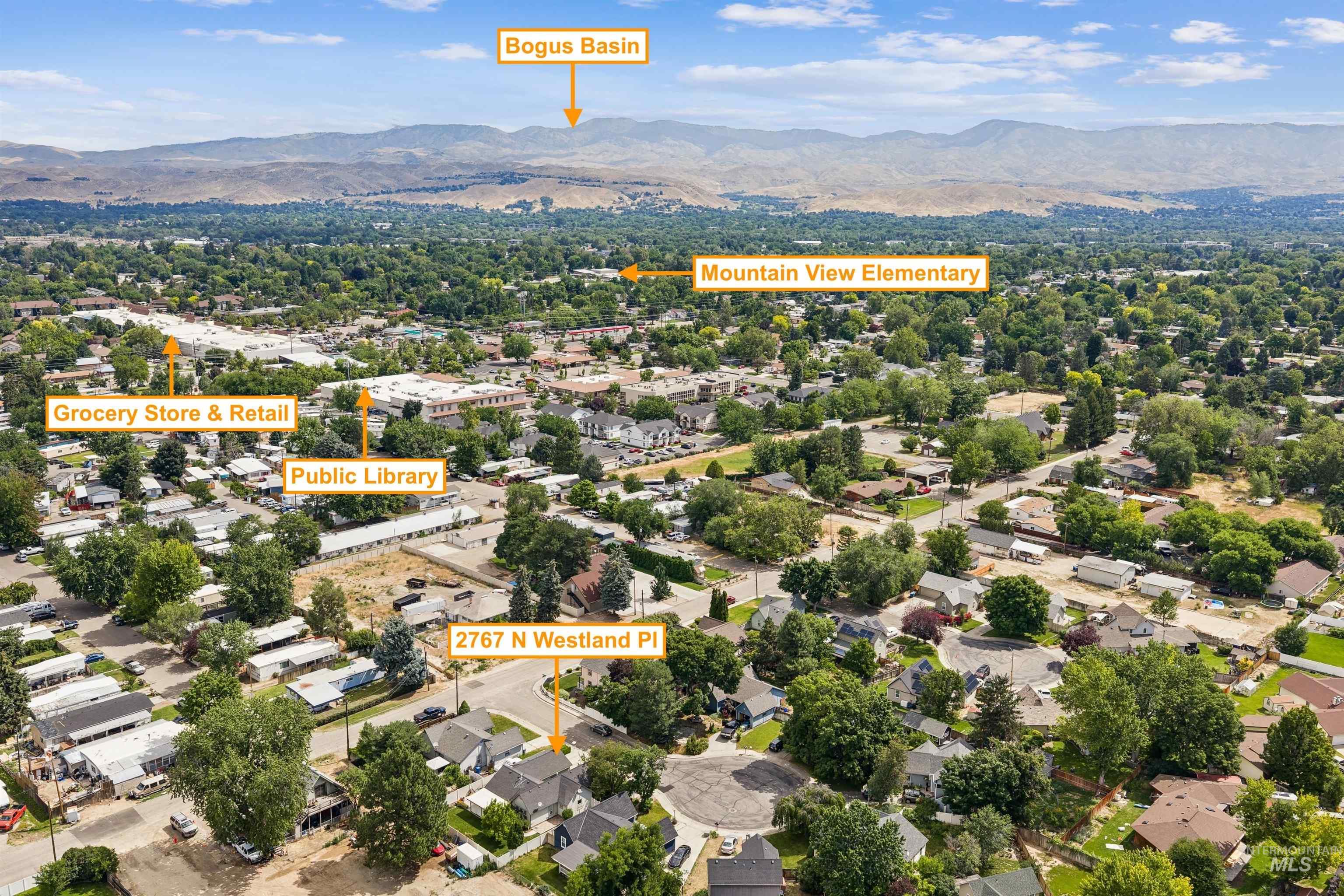 Aerial perspective showcasing the property at 2767 N Westland Pl, surrounded by a verdant neighborhood with mature trees