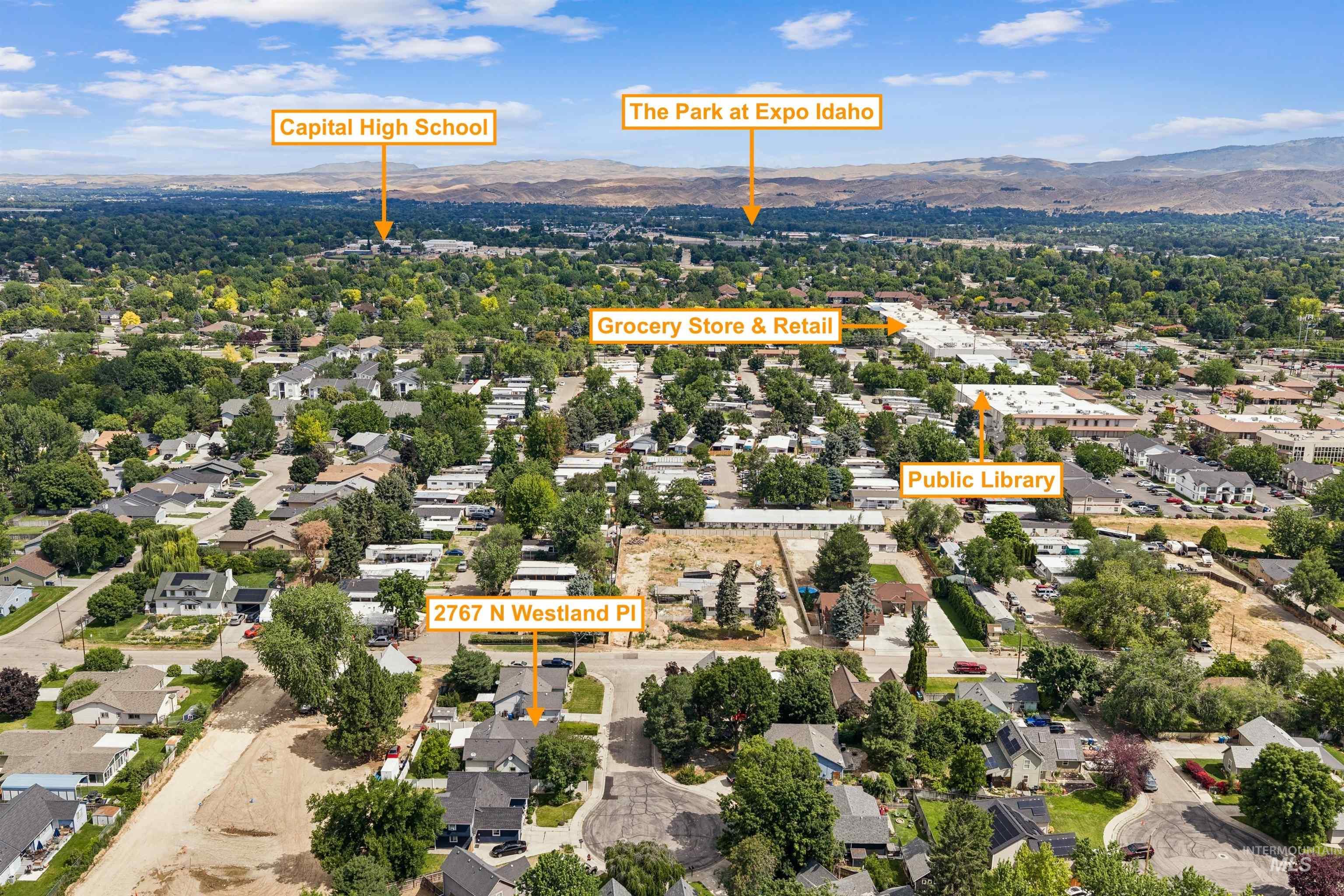 Aerial perspective of a residential neighborhood with visible community amenities