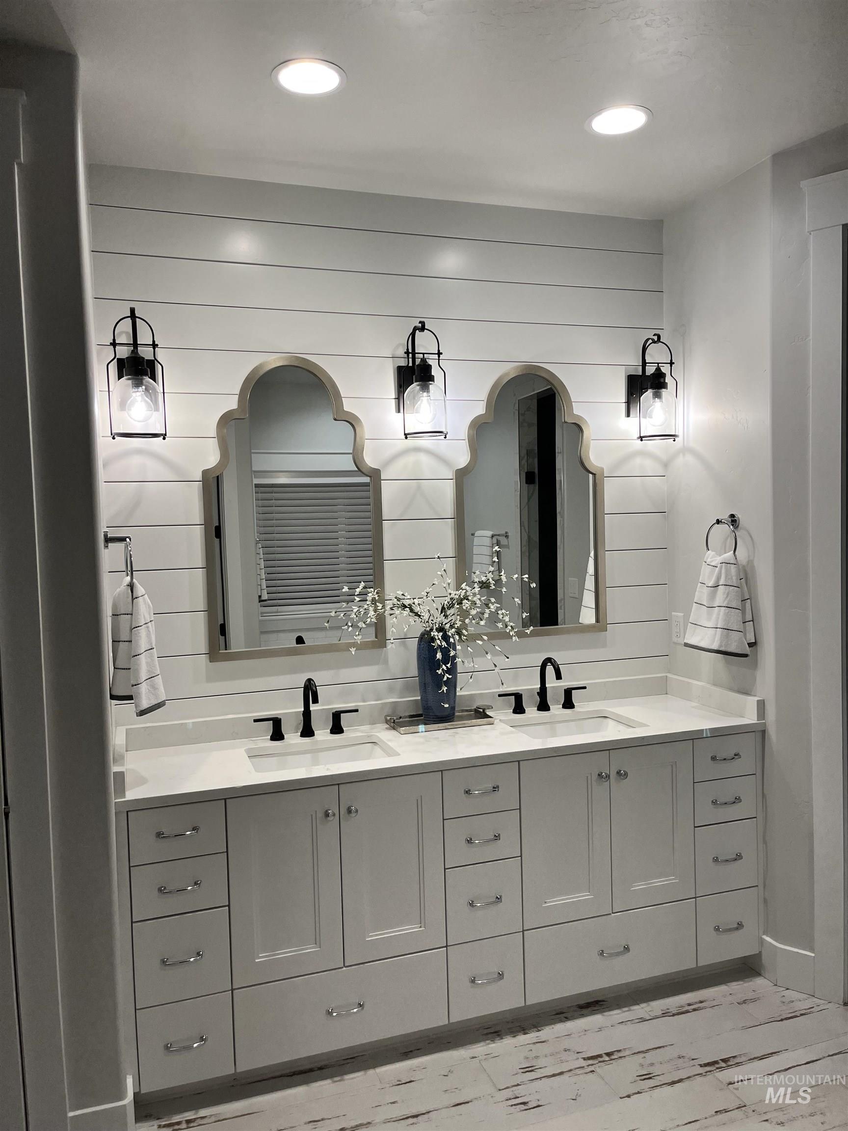 Master Bath with double vanity, ship lap, and recessed lighting