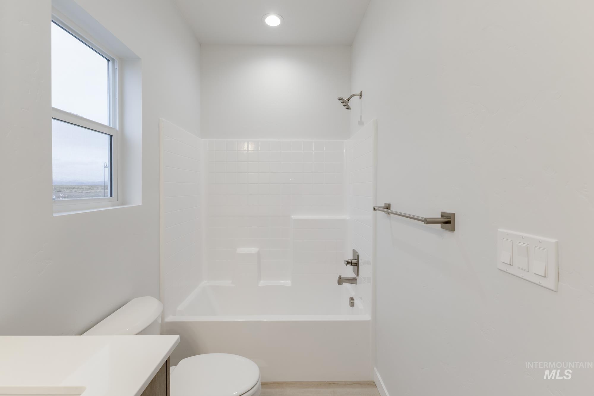 Bathroom featuring vanity and bathing tub / shower combination