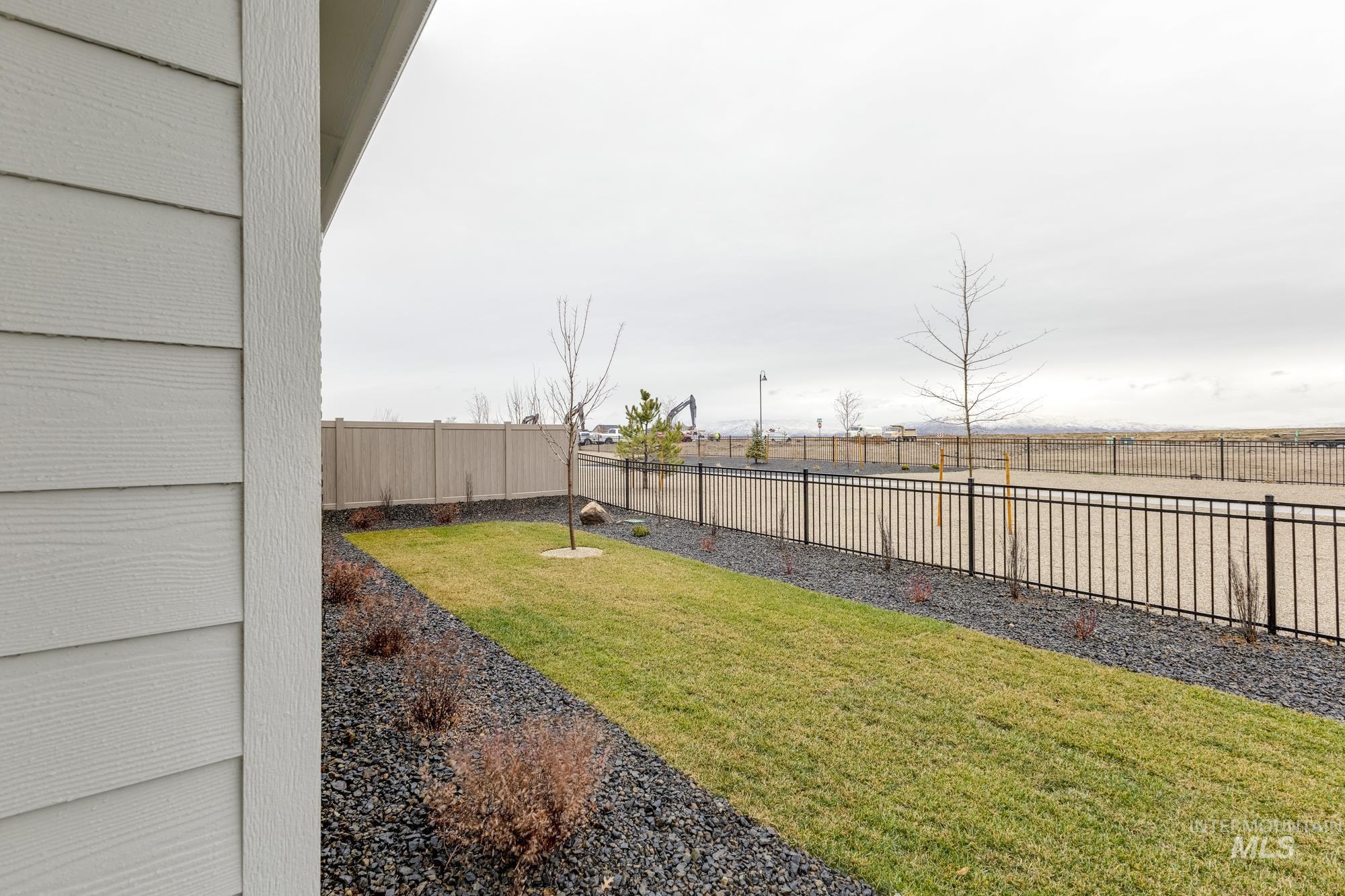 View of fenced backyard