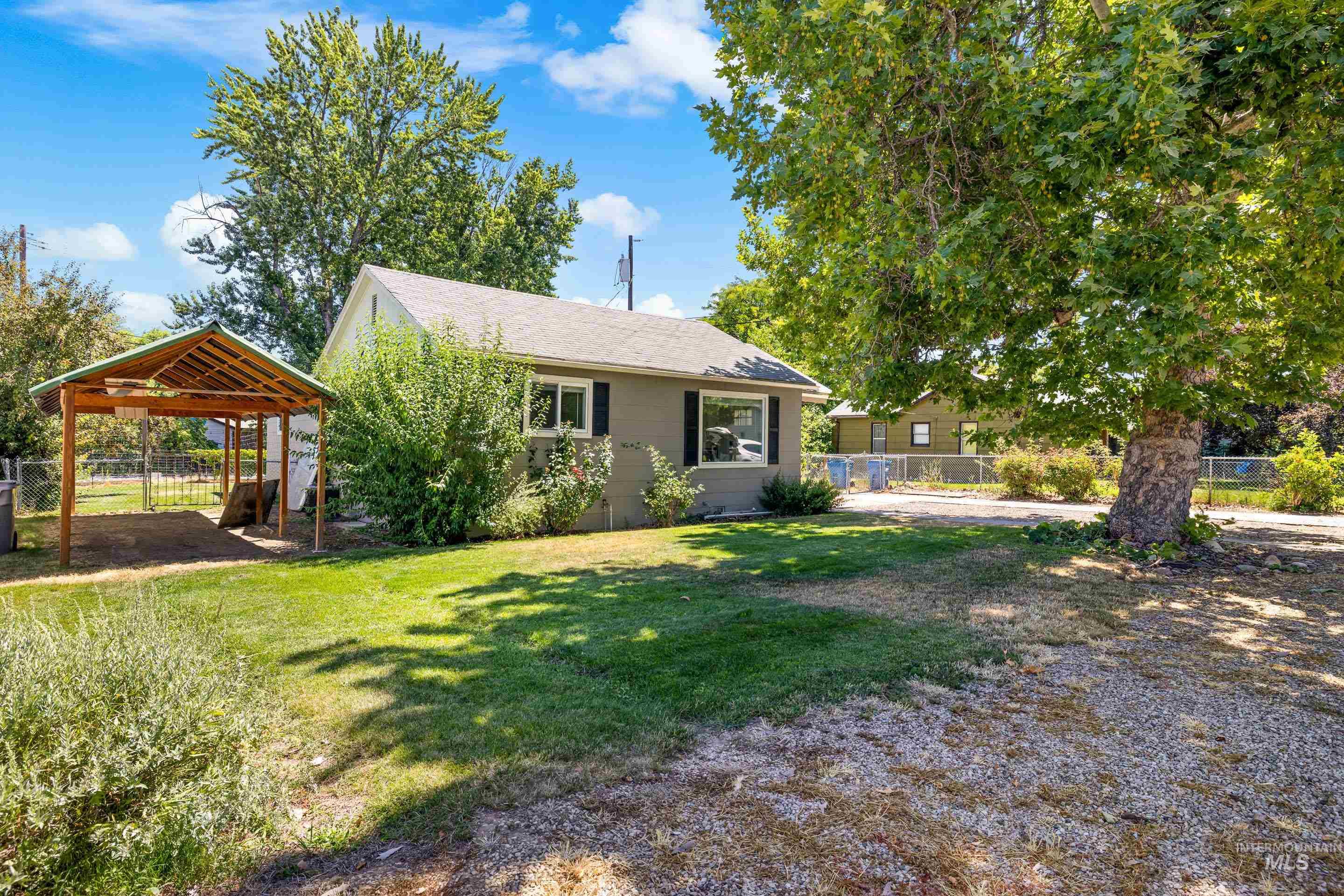 View of front facade featuring a carport