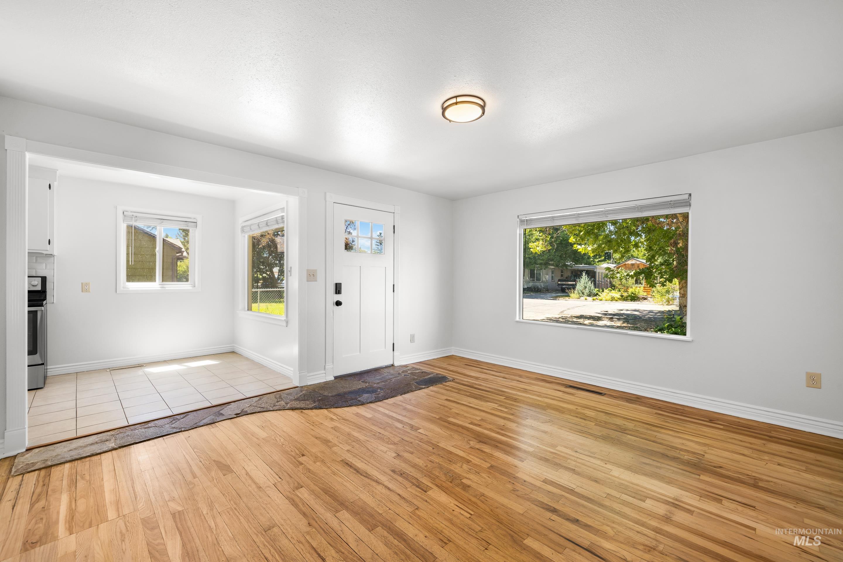 Entryway featuring light wood finished floors and baseboards