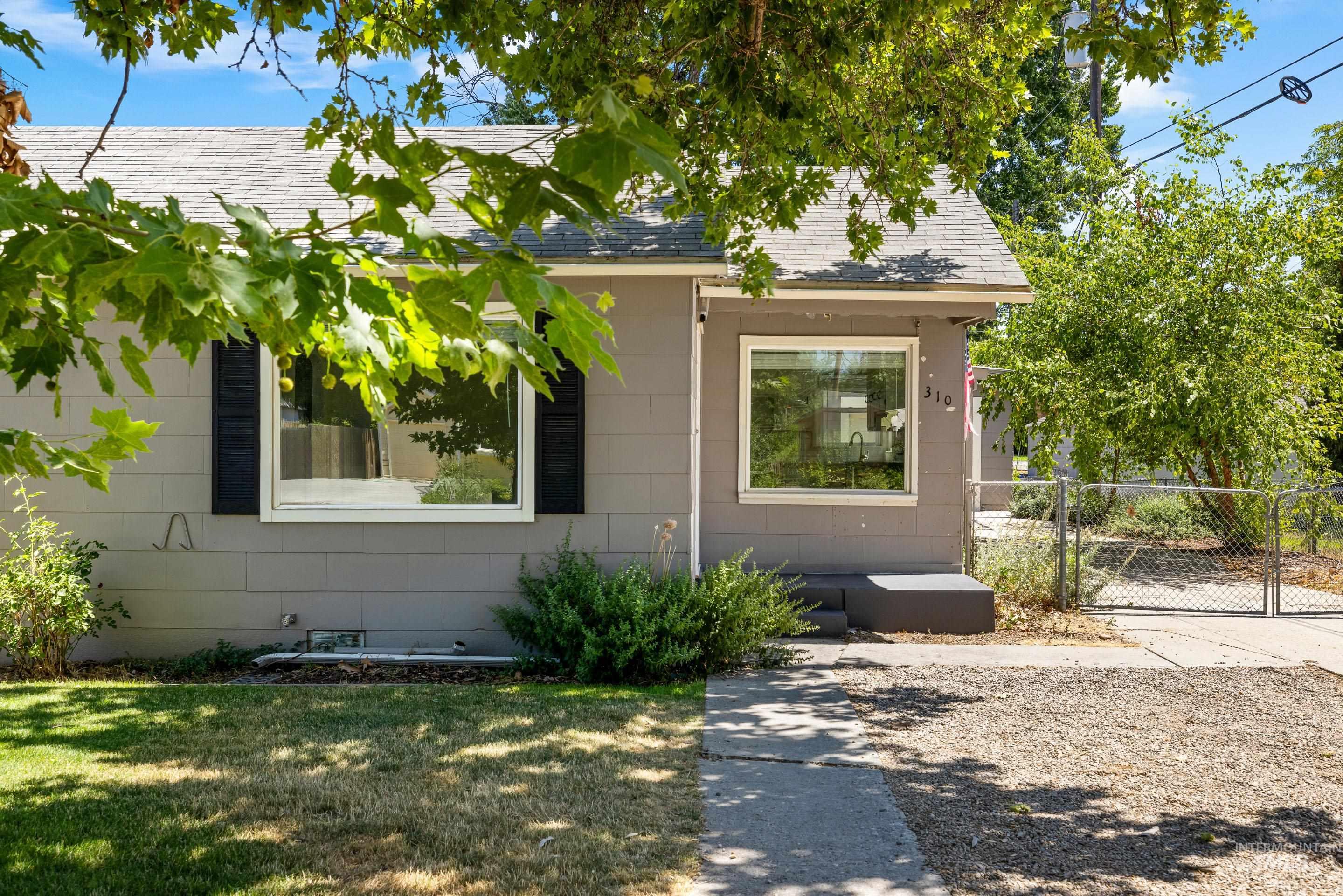View of front facade with roof with shingles