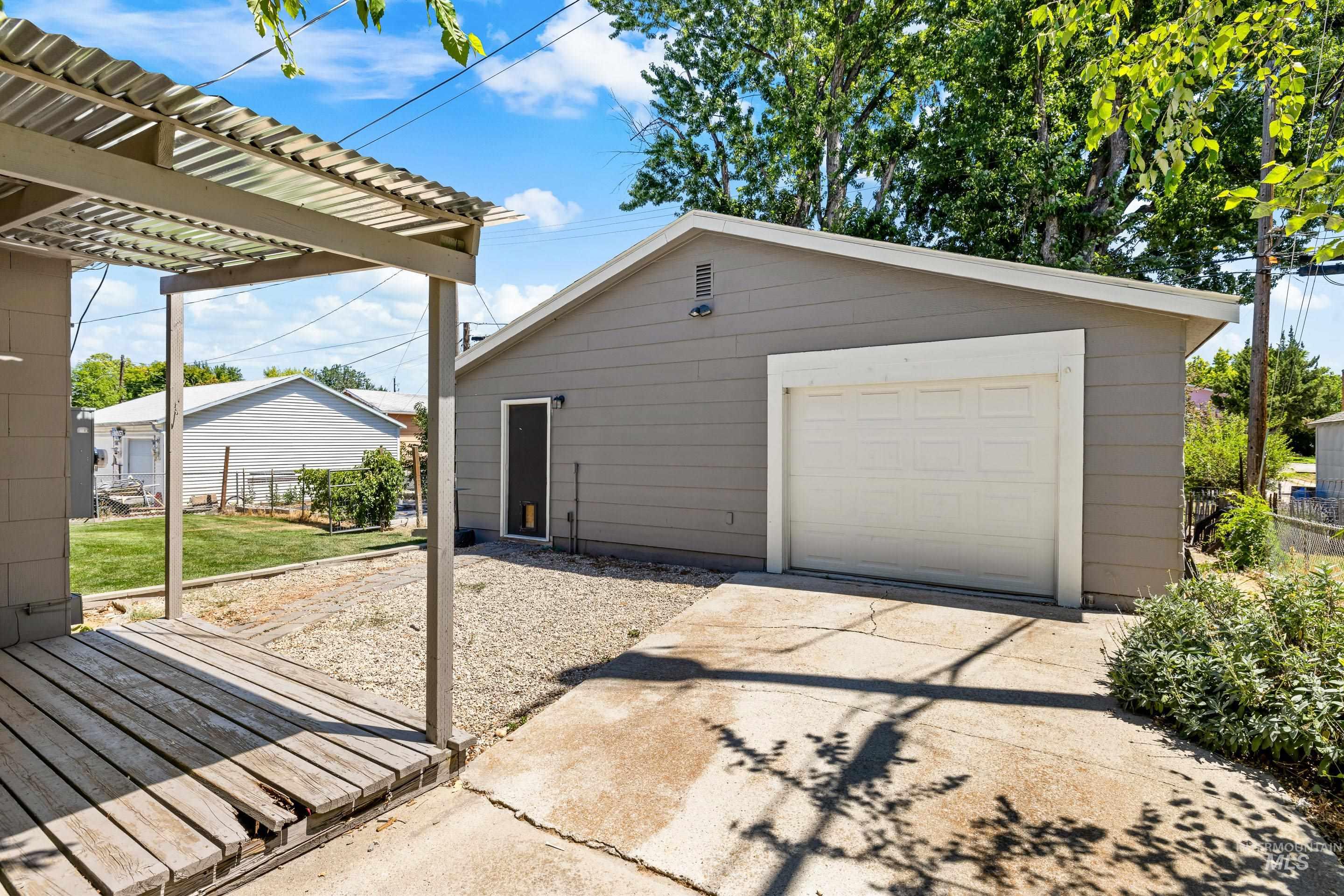 Detached garage featuring driveway