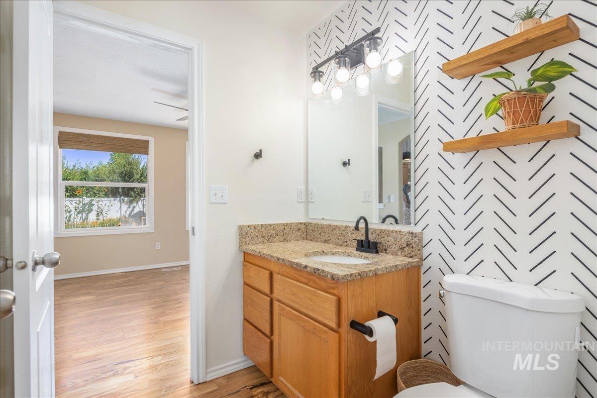 Bathroom with vanity and light wood-type flooring