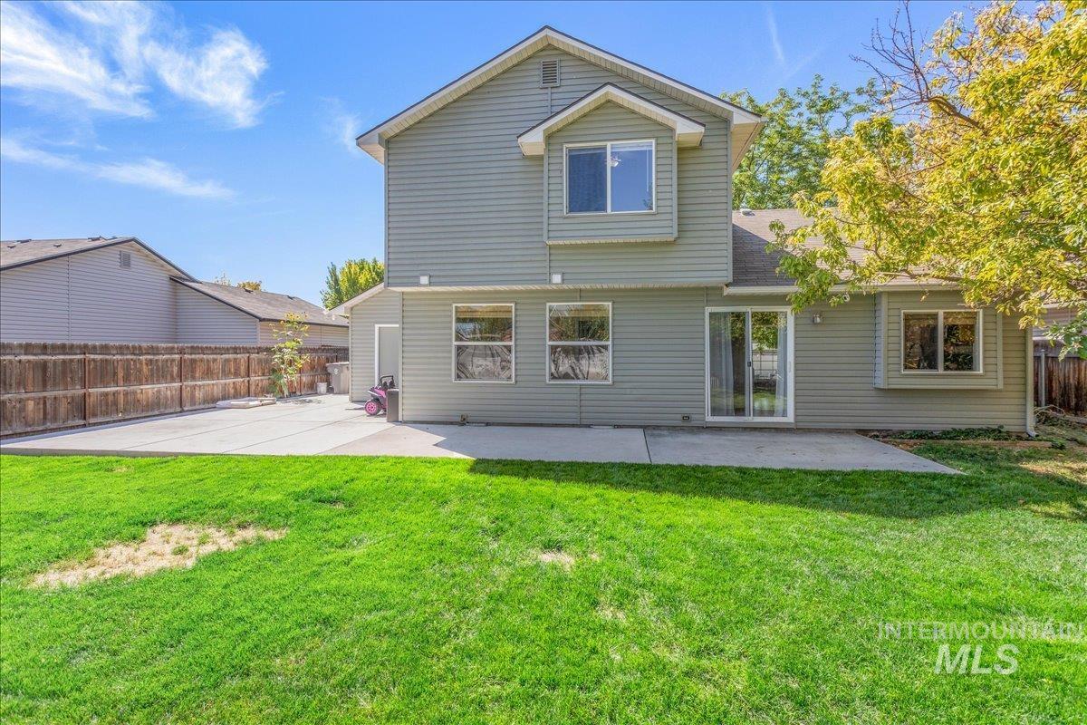 Rear view of house with a patio
