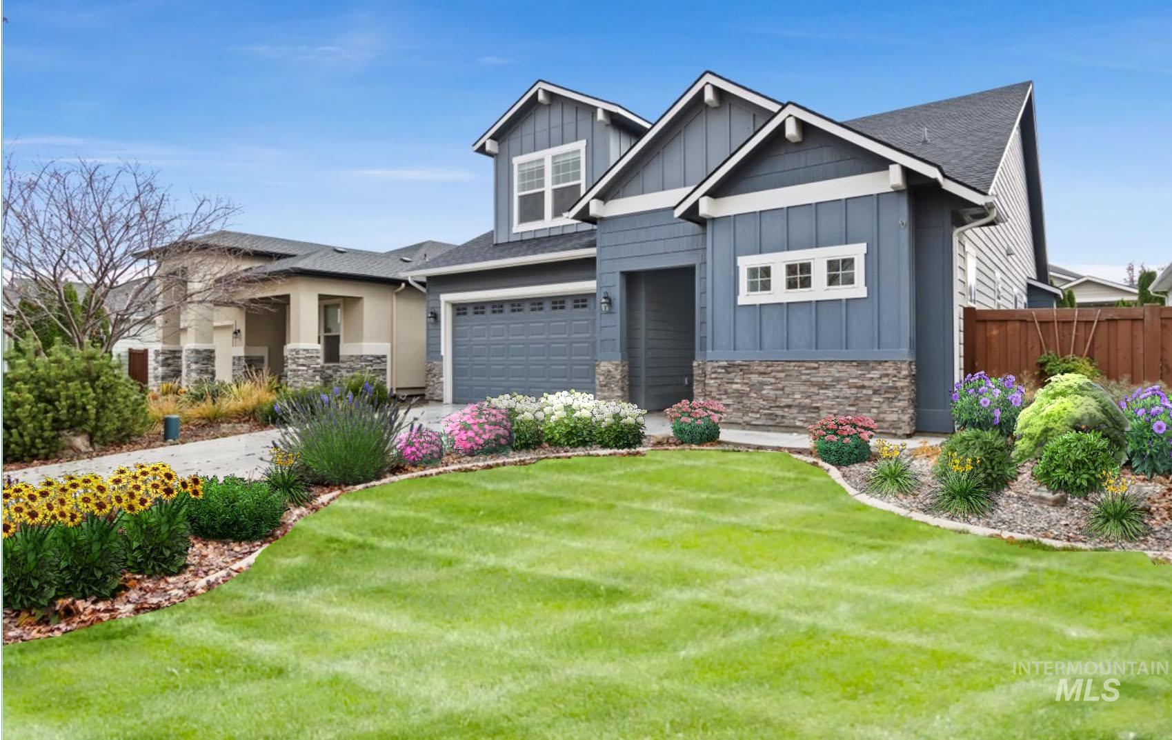 Craftsman house with board and batten siding, stone siding, and an attached garage