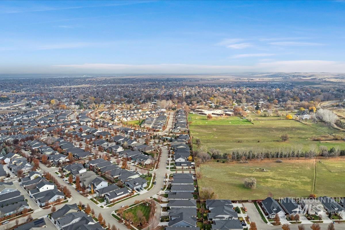 Aerial overview of property's location with nearby suburban area