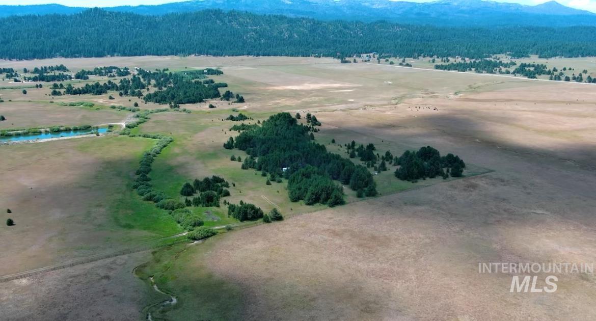 Overview of rural landscape featuring a mountain backdrop