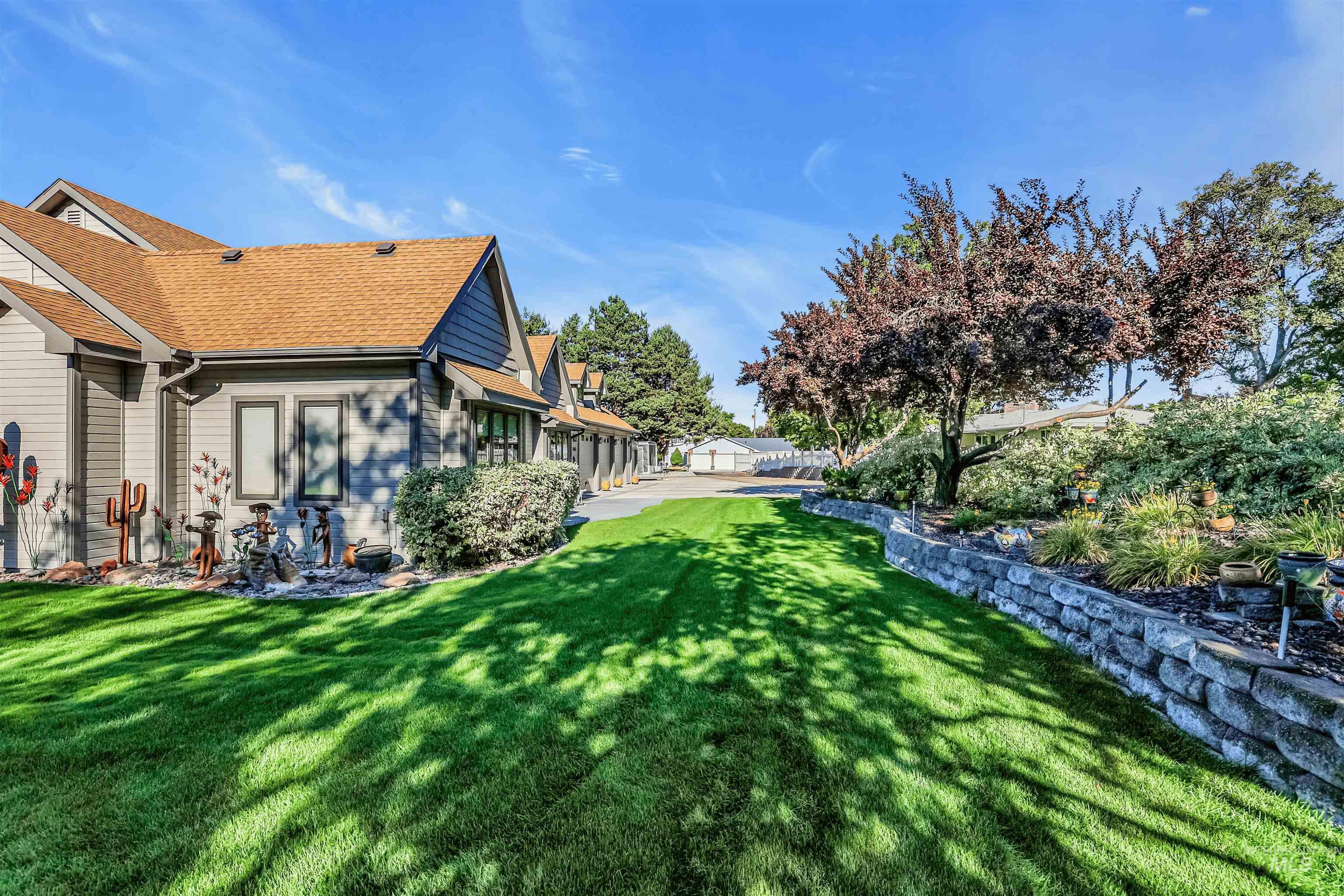 View of green lawn featuring a residential view