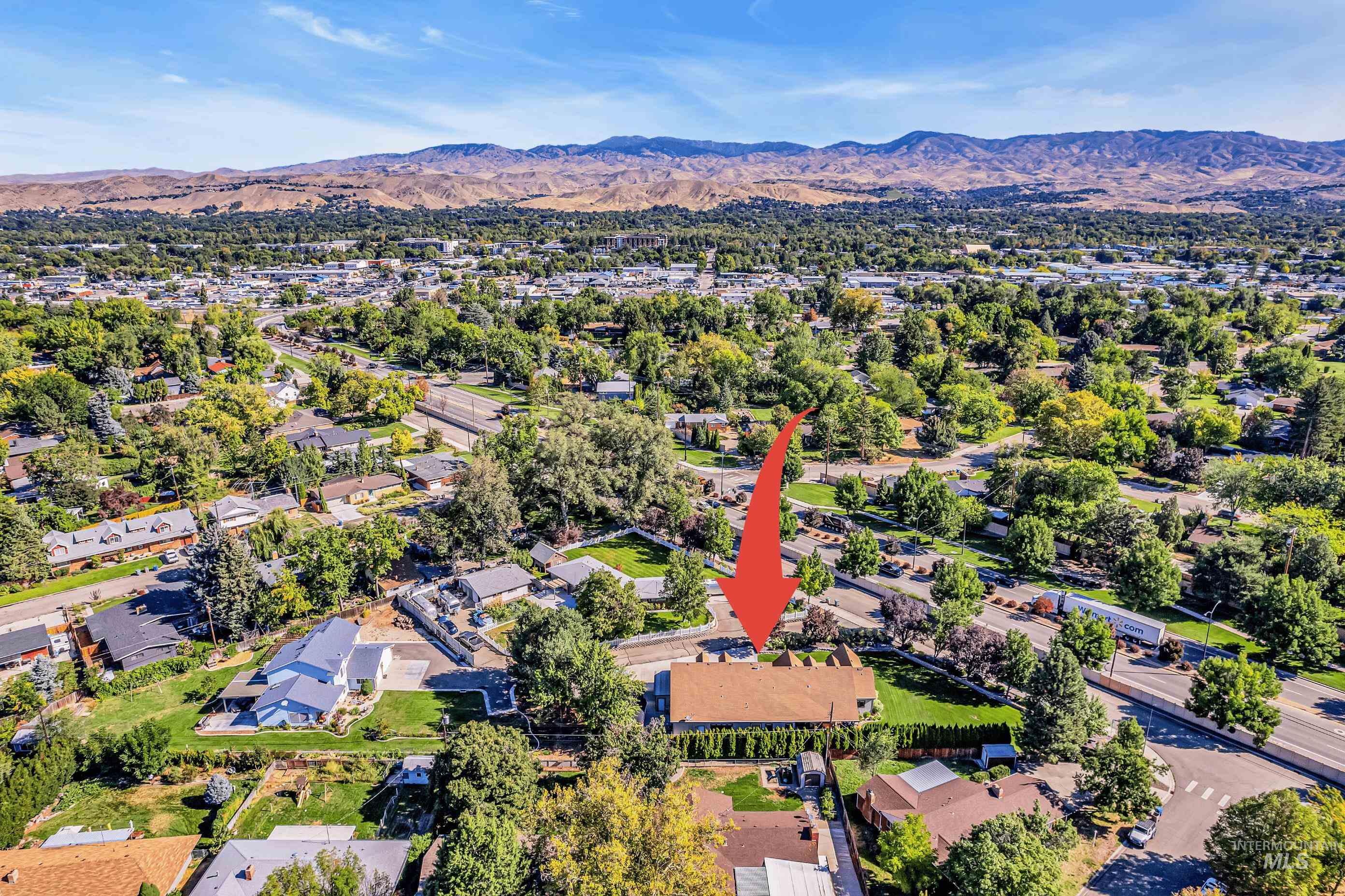 Aerial view of residential area with a mountain backdrop