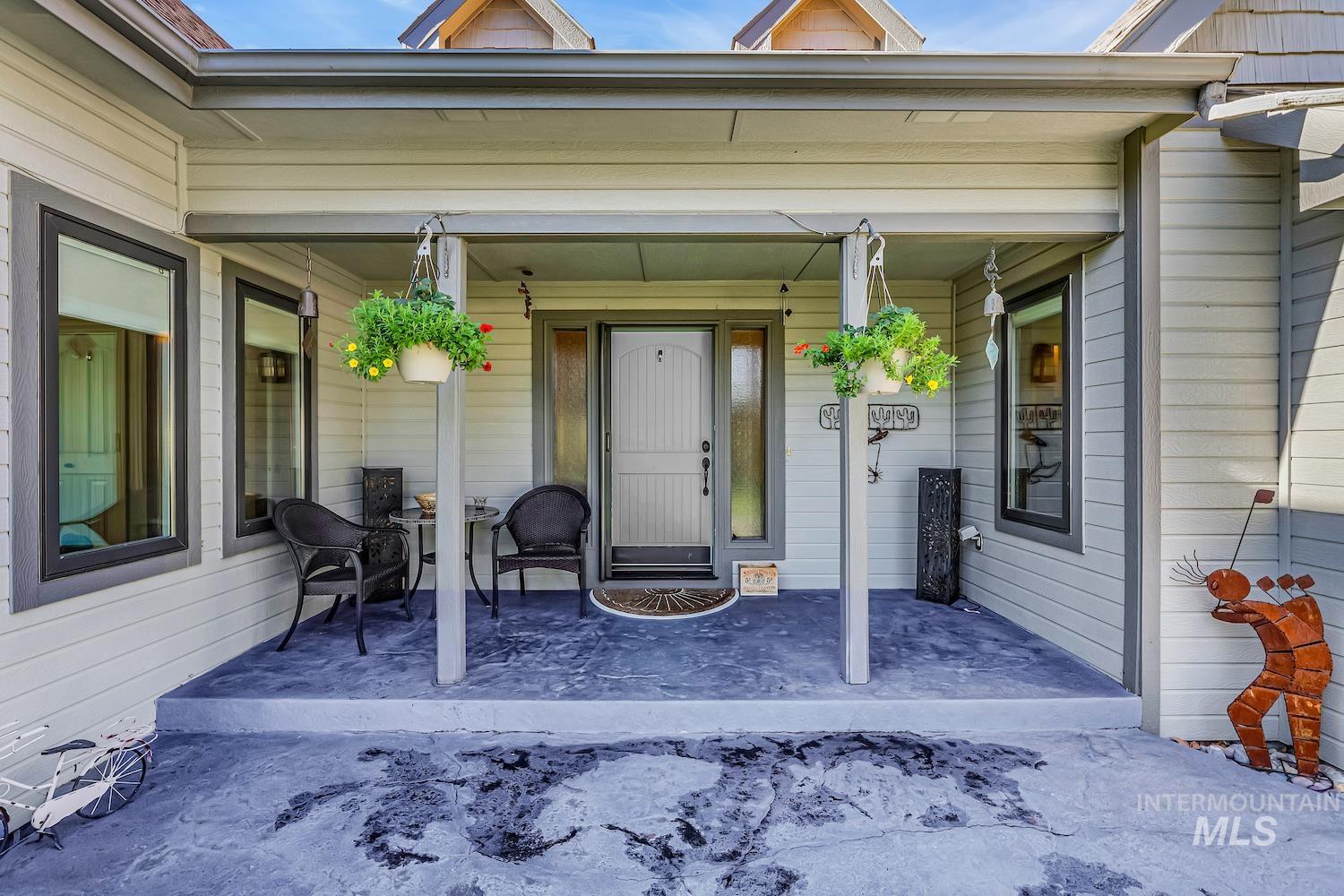 View of exterior entry with covered porch