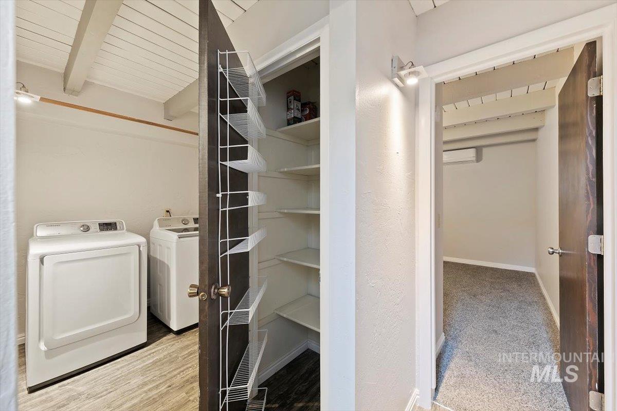 Closet featuring washing machine and dryer