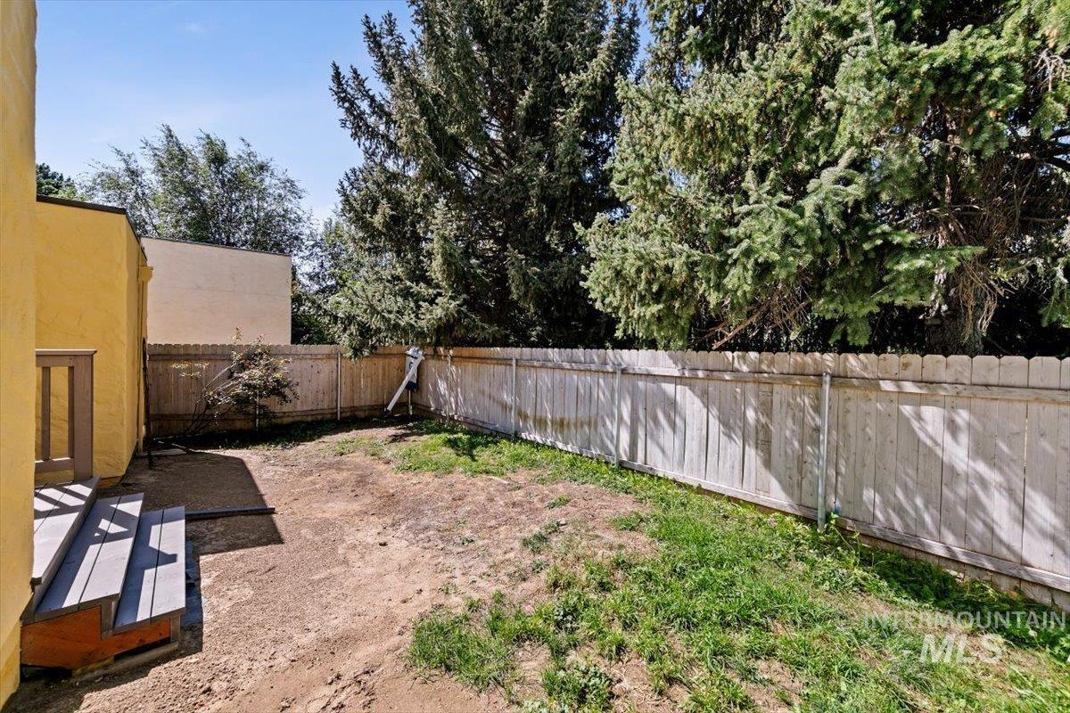 View of fenced backyard