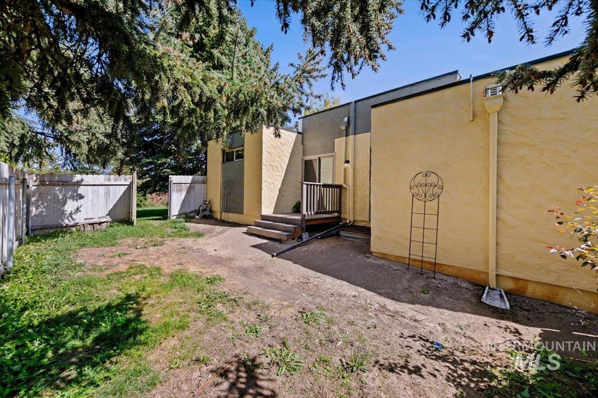 View of yard with a wooden deck