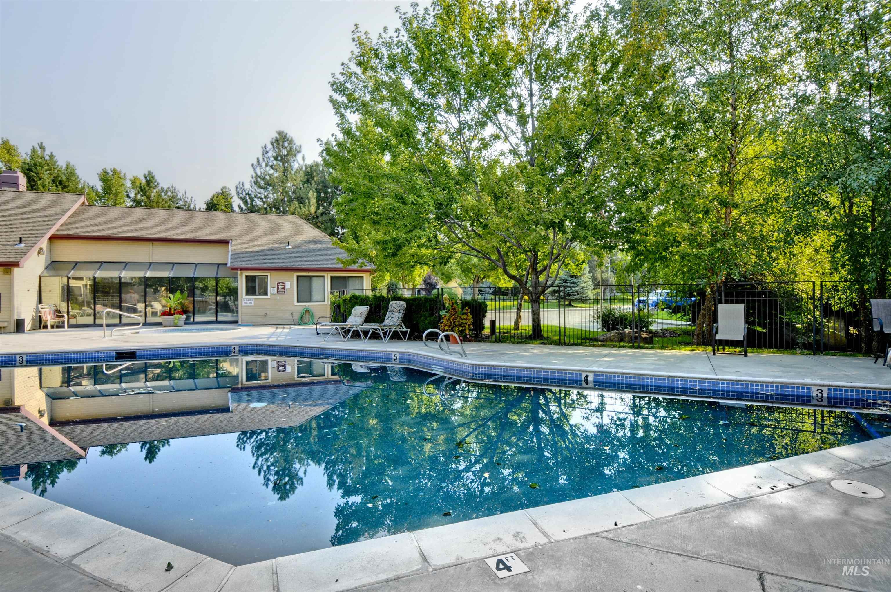 Community pool with a patio area