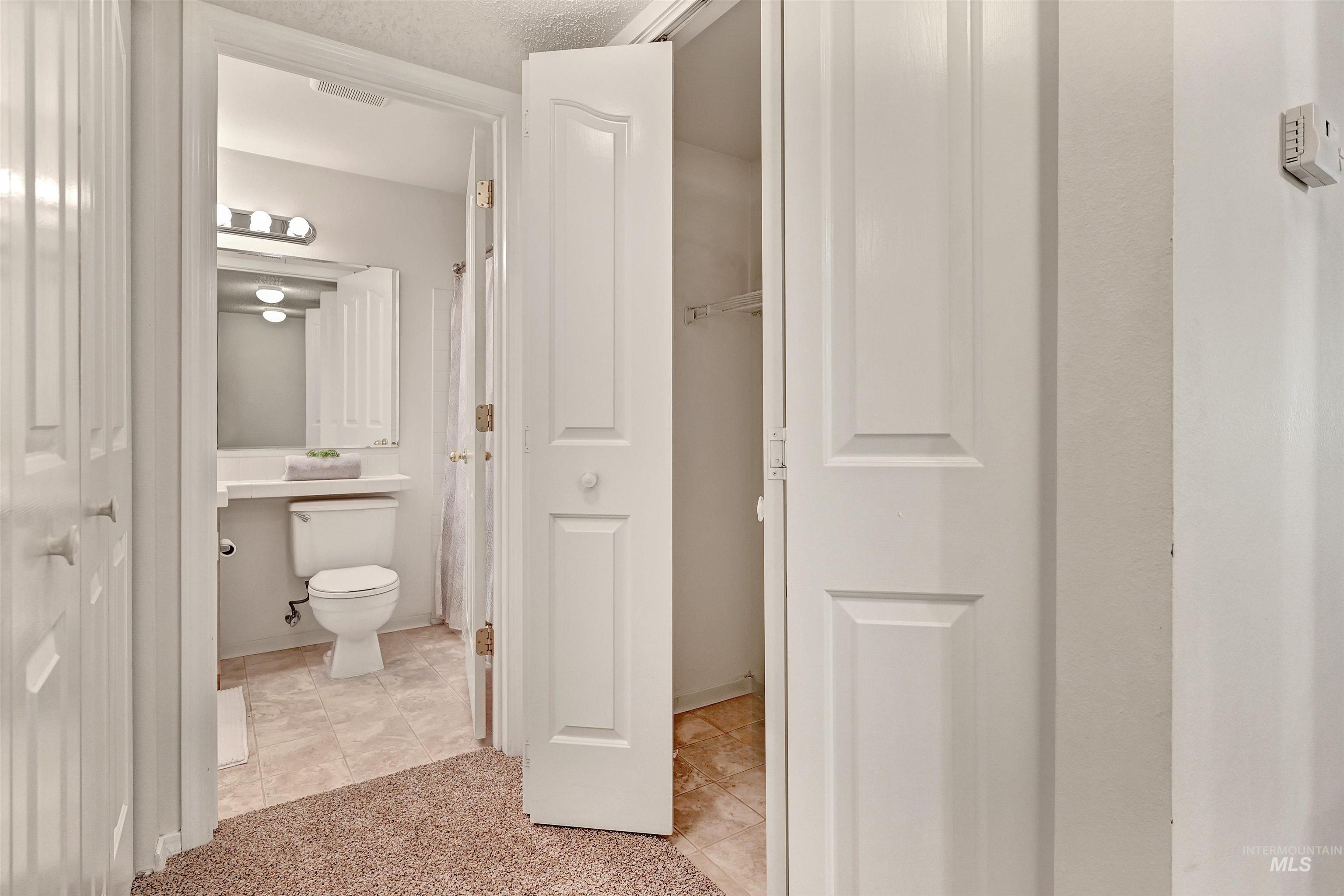 Bathroom and closet for in unit washer and dryer.